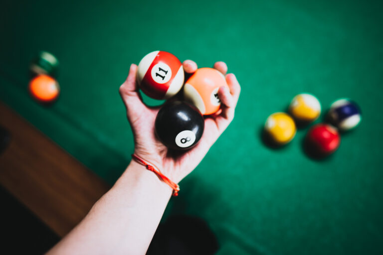 man-holding-vintage-billiard-balls-in-his-hand-picjumbo-com