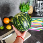 man-holding-a-small-watermelon-picjumbo-com