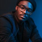 editorial-studio-portrait-of-a-young-man-in-a-cap-and-fashion-glasses-picjumbo-com