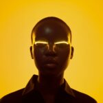 futuristic-portrait-of-woman-with-glowing-eyes-and-yellow-background-picjumbo-com
