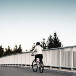 woman-riding-a-bicycle-and-wearing-a-helmet-picjumbo-com