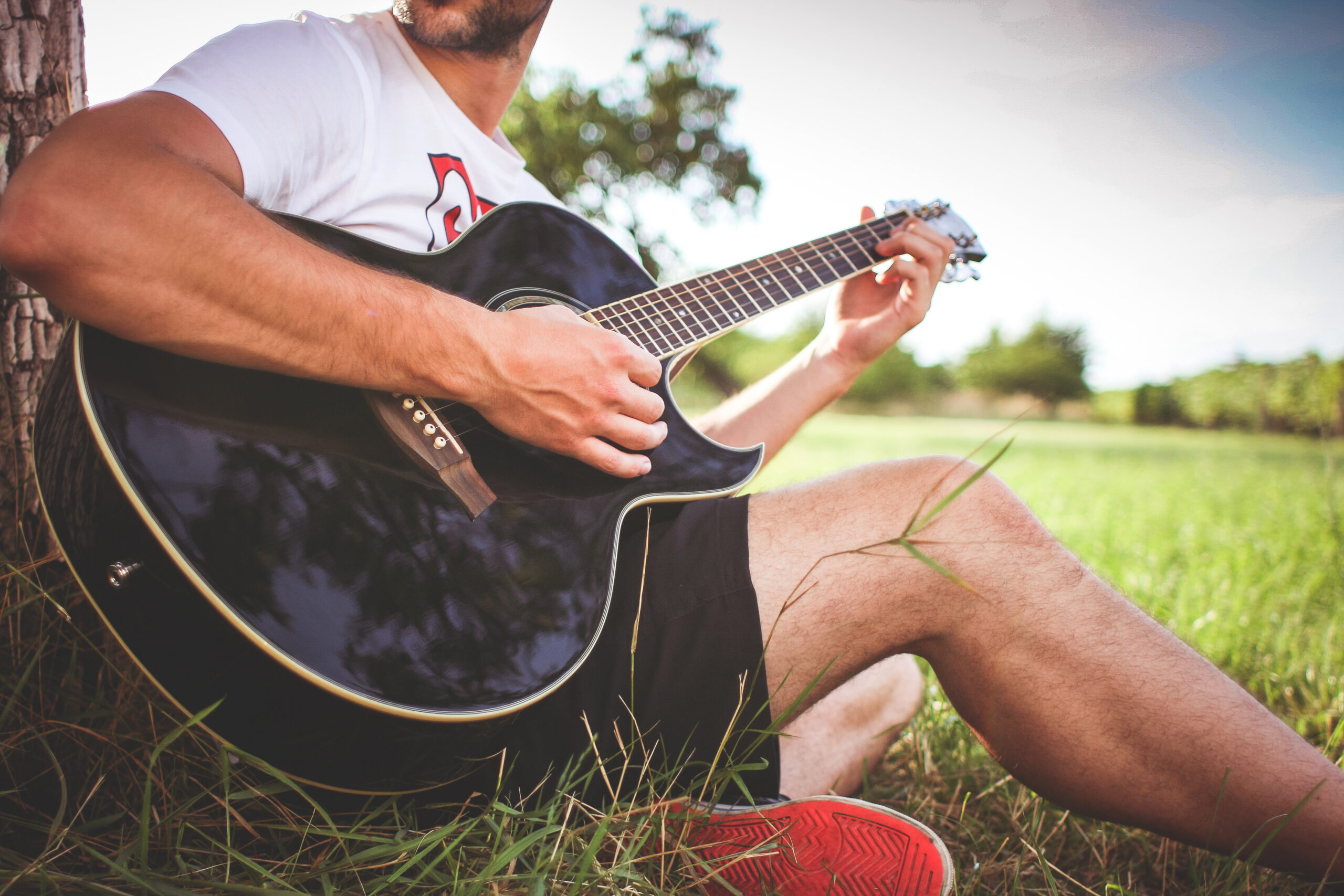 guy-playing-acoustic-guitar-in-nature-picjumbo-com (1)