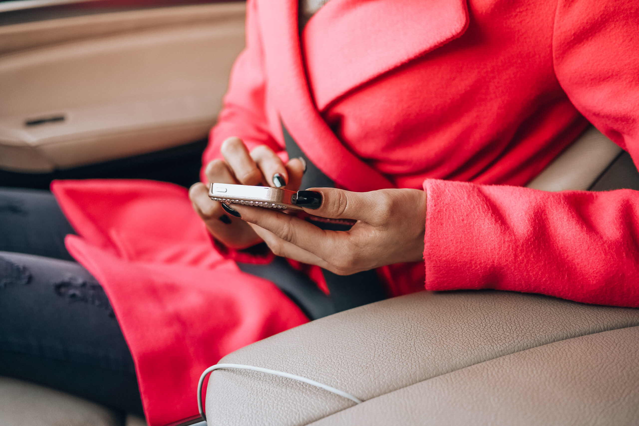 nicely-dressed-woman-using-her-phone-in-a-car-picjumbo-com